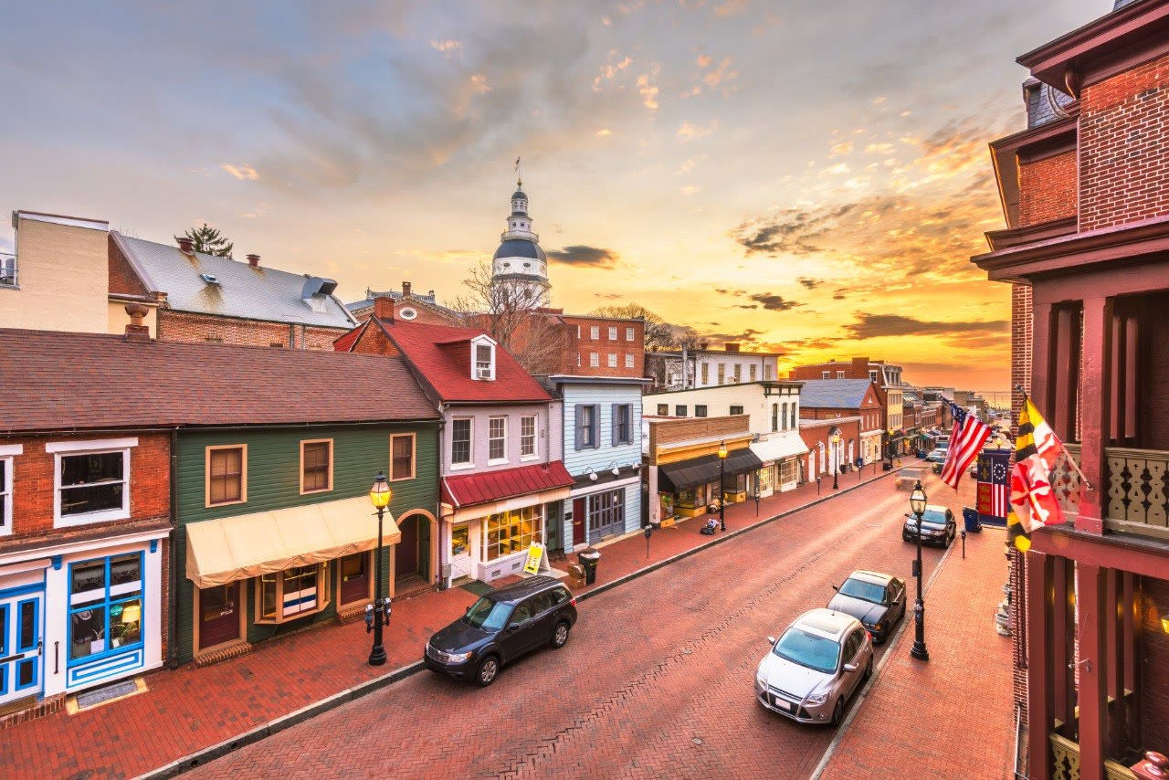 Main Street in Annapolis at sunset with the Maryland State House dome