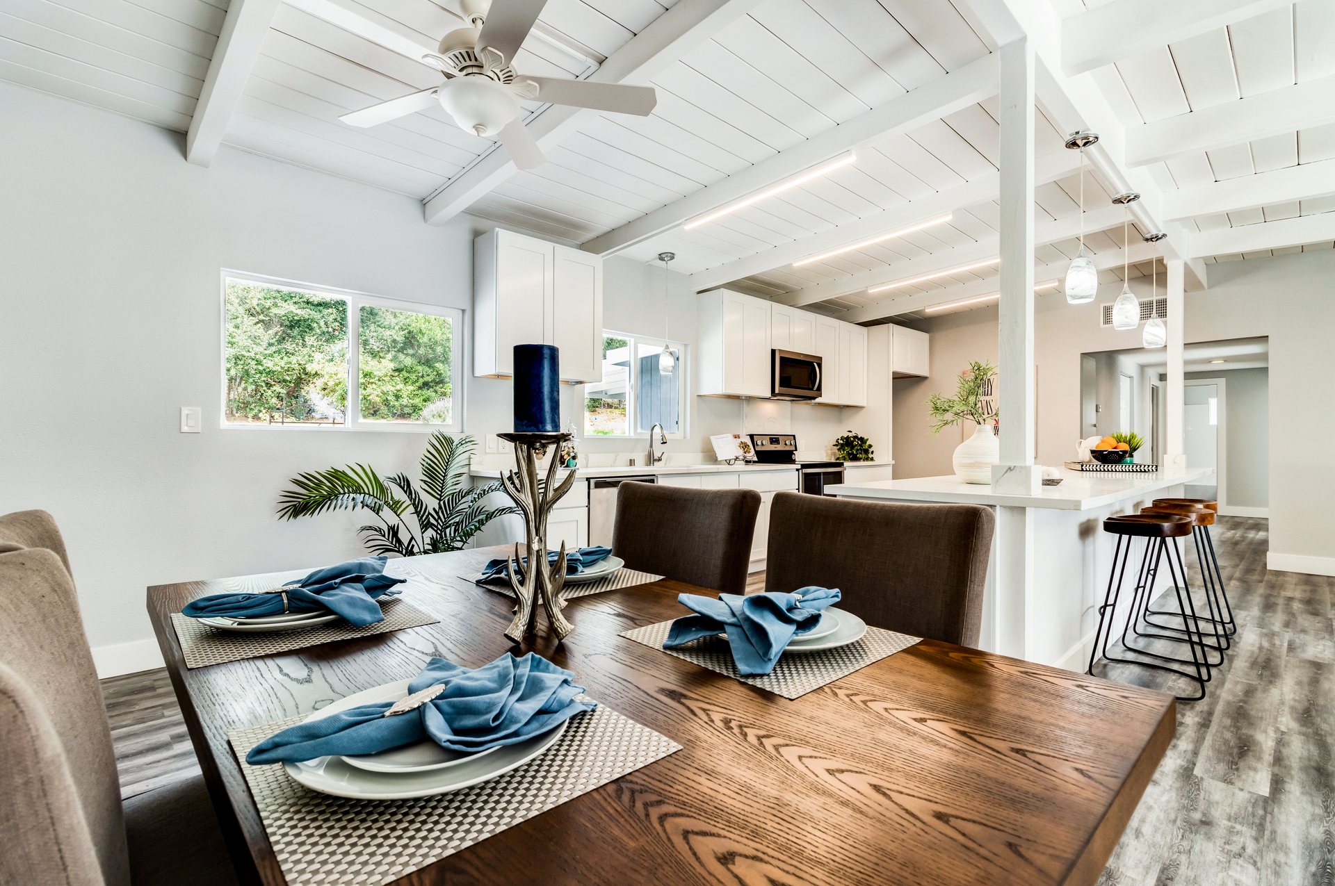 Bright staged dining and kitchen interior